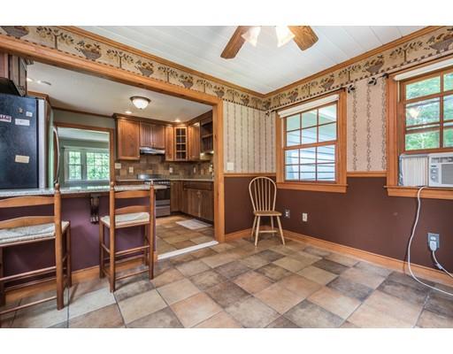 37 Packard Road Stow, MA 01775 - Photo 9 of 42 a view of a livingroom with furniture and windows