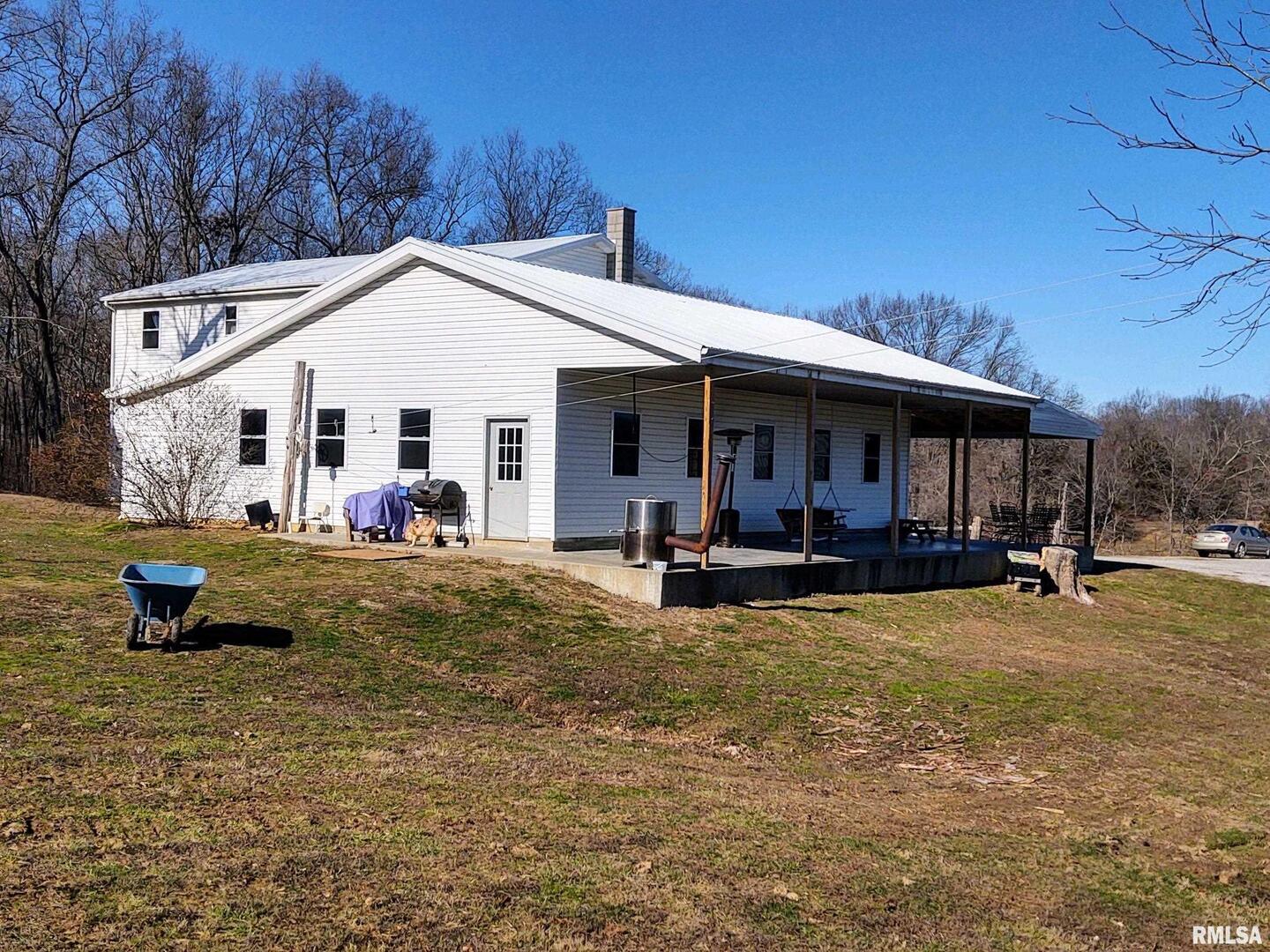 6270 Buncombe Road Buncombe, IL 62912 - Photo 2 of 71 a view of a house with backyard porch and sitting area
