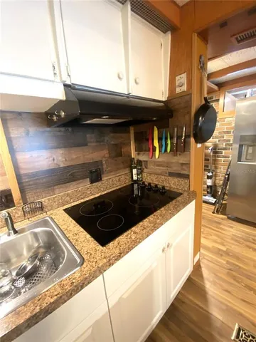 a view of a livingroom with furniture and a fireplace