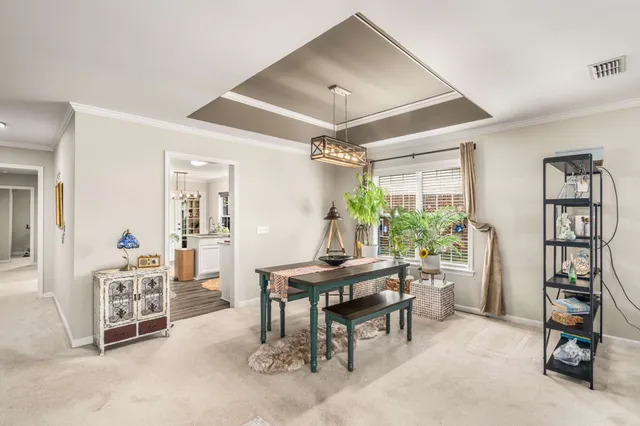 a view of a livingroom with furniture and a window