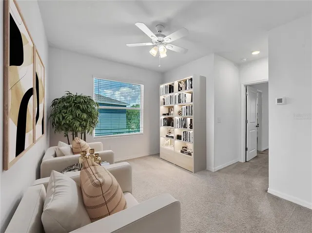 a living room with furniture and white walls