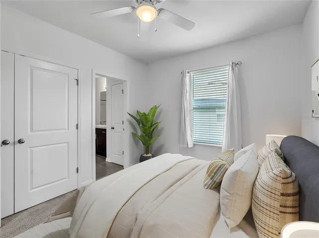 a bedroom with a bed and a window