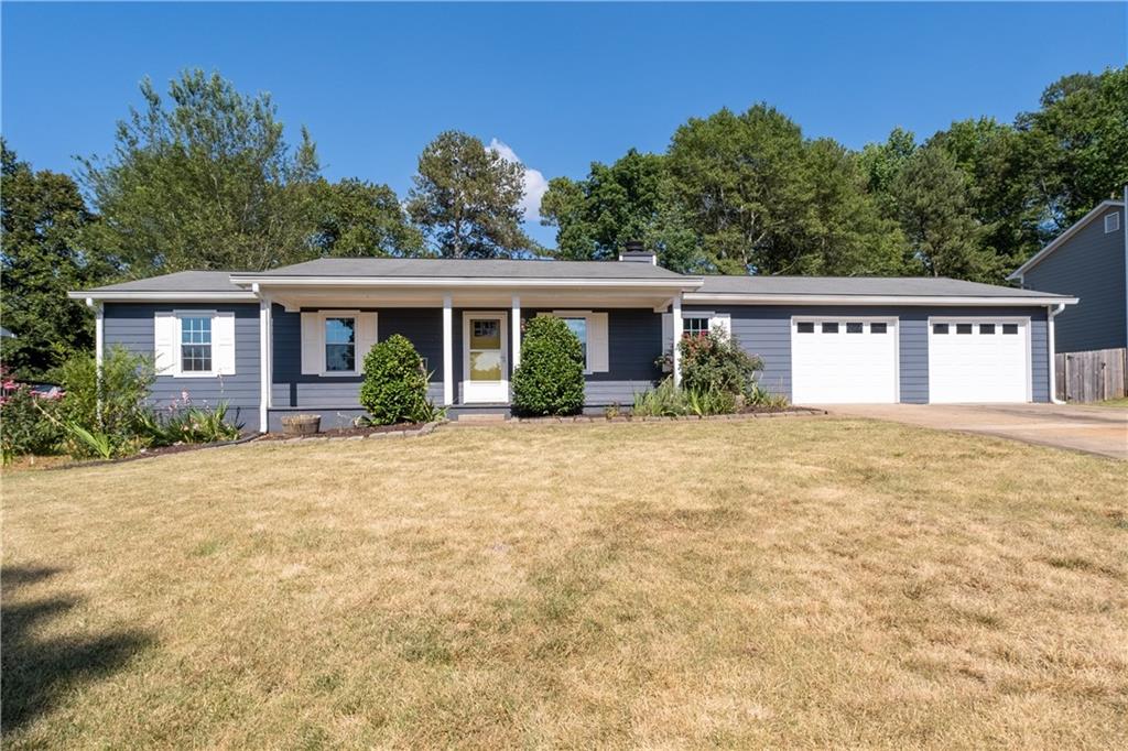 4892 Raven Way Northeast Marietta, GA 30066 - Photo 1 of 1 front view of a house with a yard
