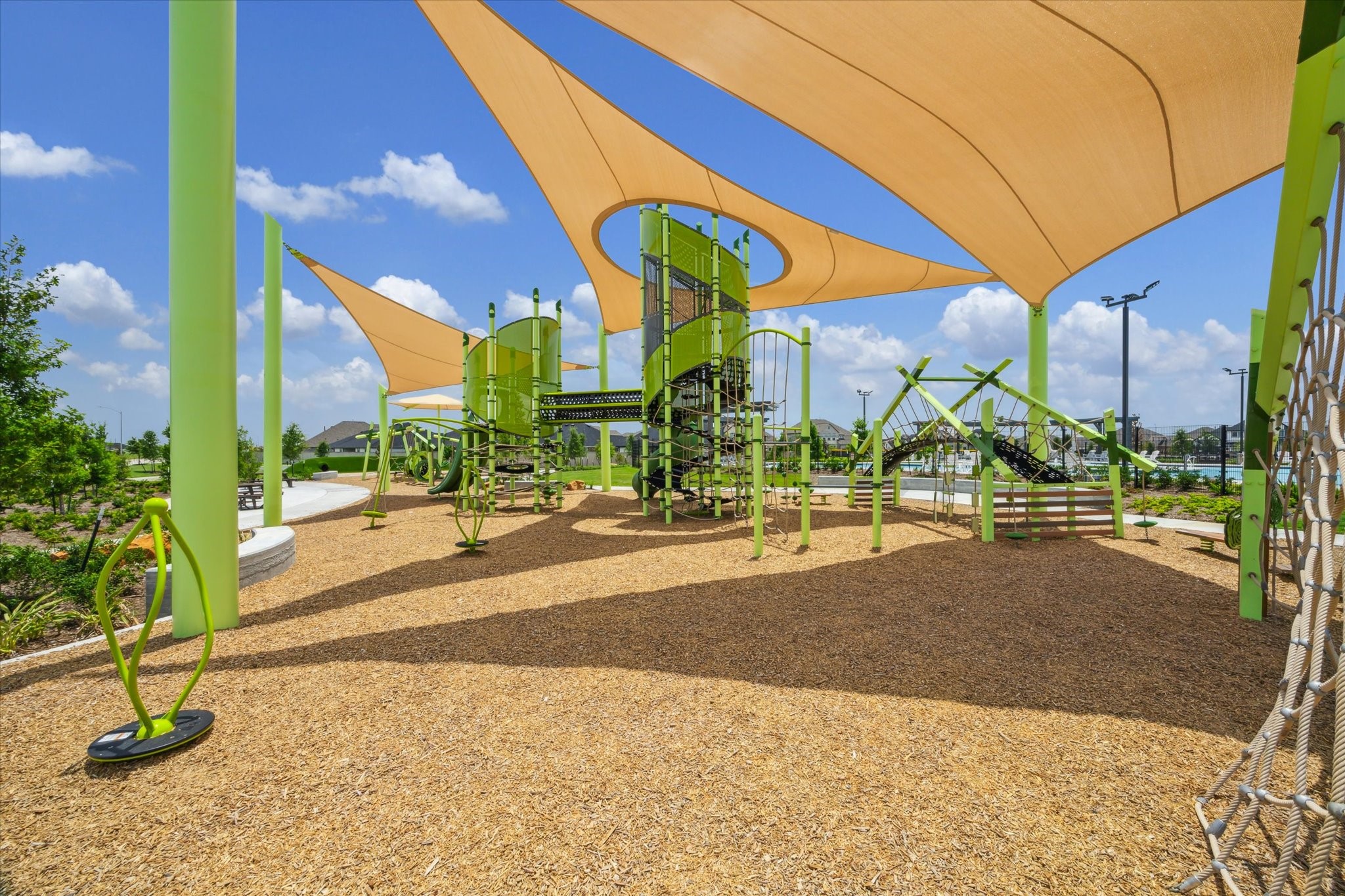3214 Rios Court League City, TX 77573 - Photo 30 of 35 Playground paradise! Bright equipment and open spaces make this community playground the perfect spot for imagination and active play.