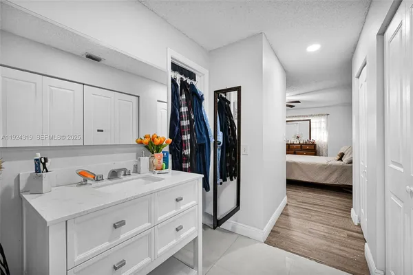 a view of living room and bedroom with furniture