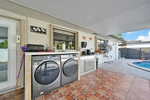 a storage room with washer and dryer