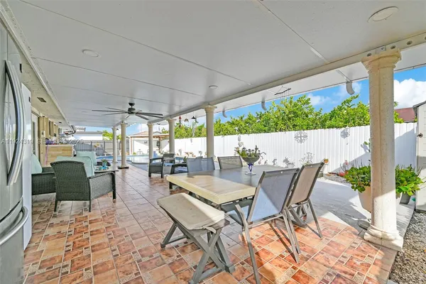 a view of an outdoor dining space with furniture