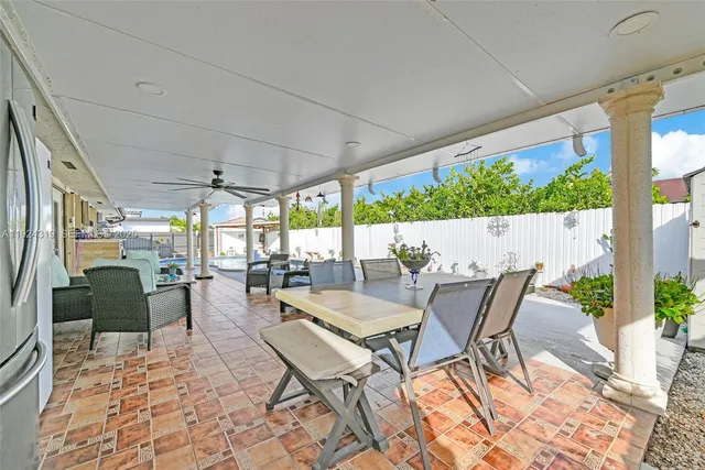 a view of an outdoor dining space with furniture