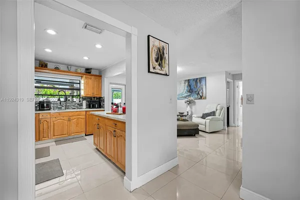 a kitchen with stainless steel appliances a refrigerator and a sink