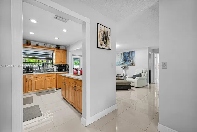 a kitchen with stainless steel appliances a refrigerator and a sink