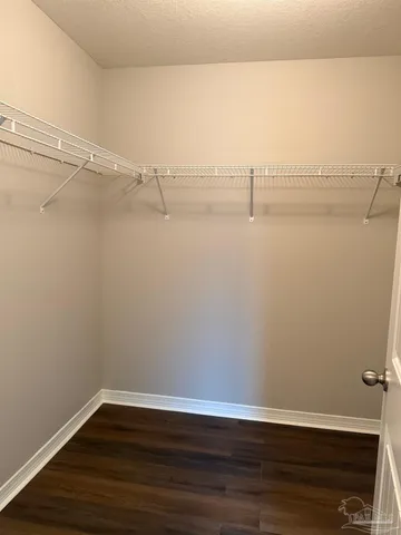 a view of a room with racks on the wall