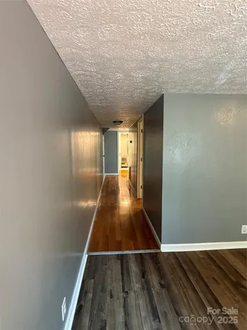 a view of gallery with wooden floor