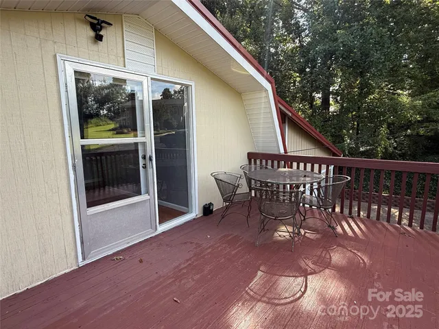 a view of a balcony with furniture