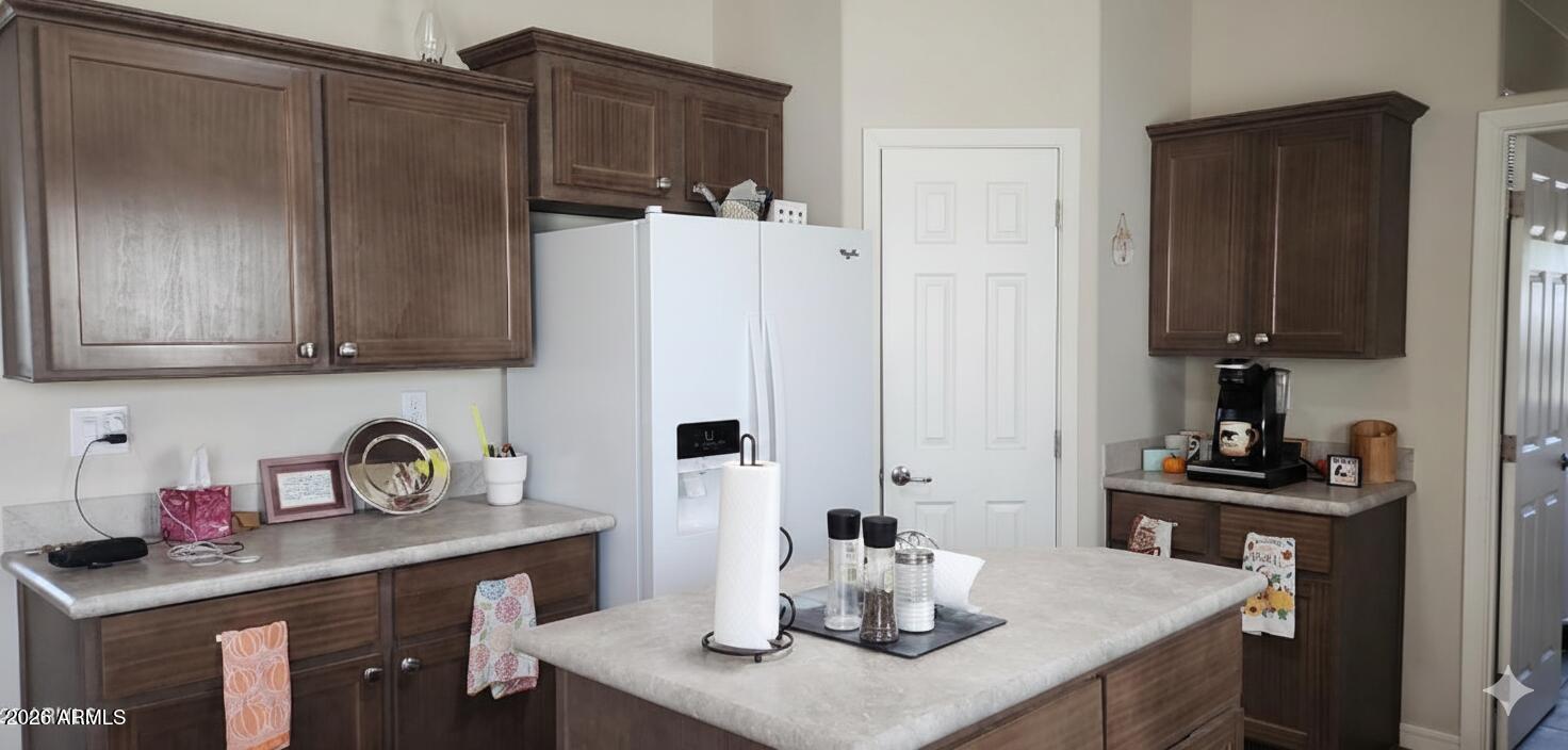 1983 Crystal Lane Springerville, AZ 85938 - Photo 11 of 27 a kitchen with stainless steel appliances granite countertop a sink a stove and refrigerator
