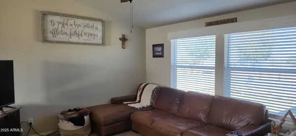 a living room with furniture and a window