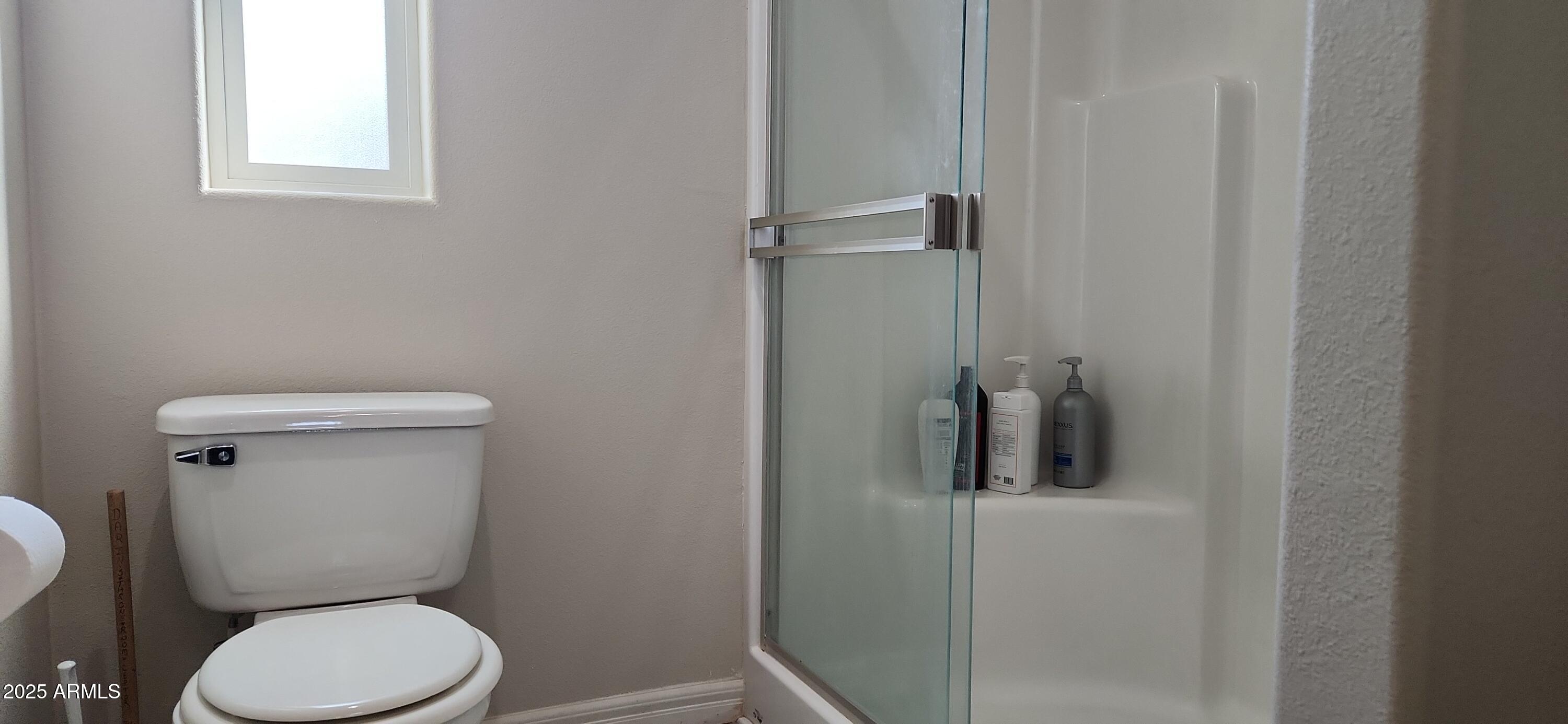 1983 Crystal Lane Springerville, AZ 85938 - Photo 17 of 27 a white toilet sitting next to a bathroom sink