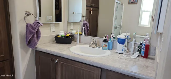 a bathroom with a sink and a mirror