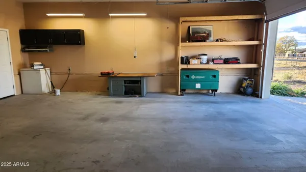 a view of a livingroom with shelves