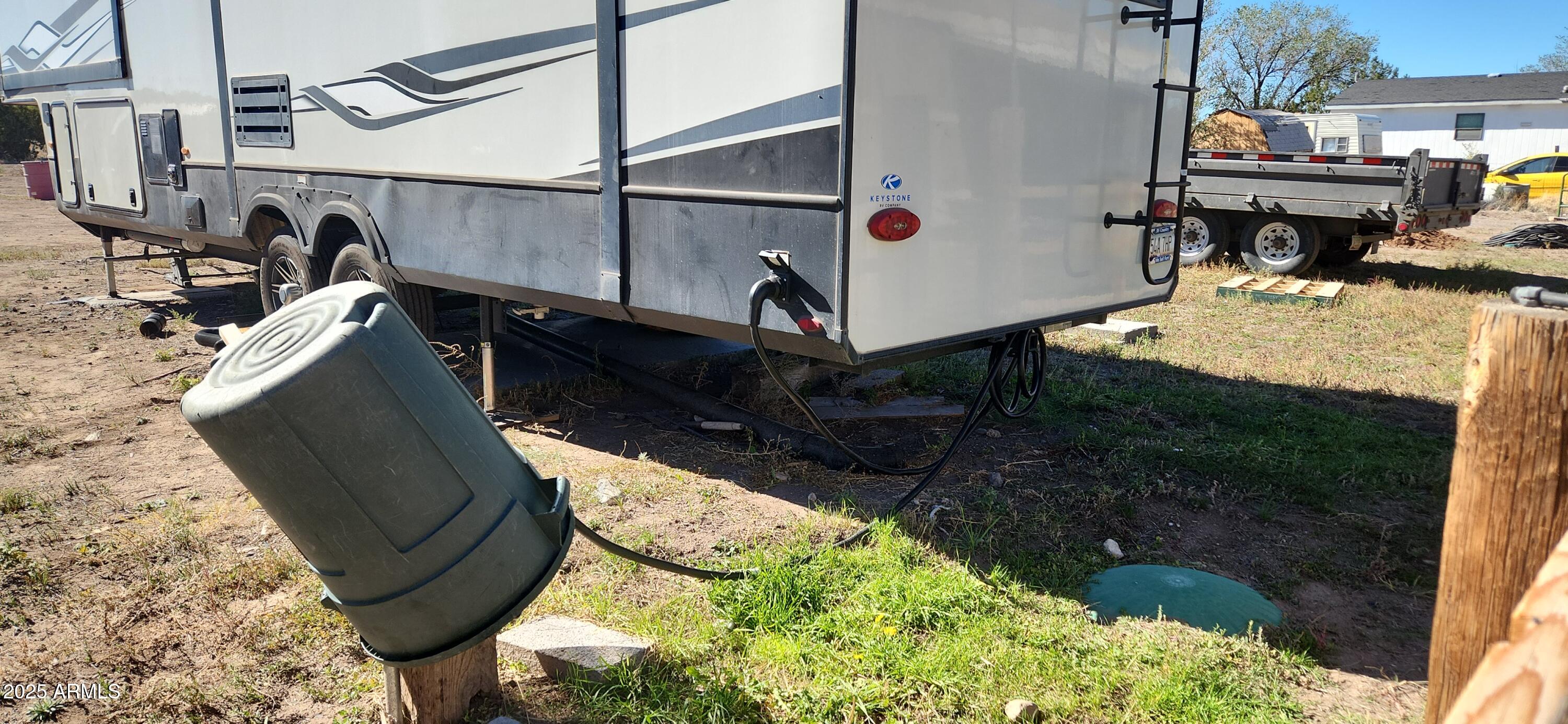 1983 Crystal Lane Springerville, AZ 85938 - Photo 7 of 27 a view of roof deck with wooden fence and a potted plant