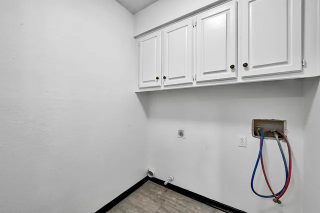 a view of a room with gym equipment and a large window