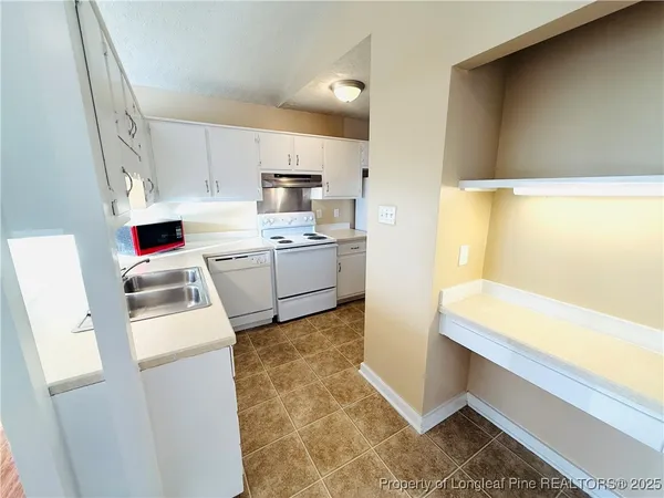 a room with a washer dryer and washer