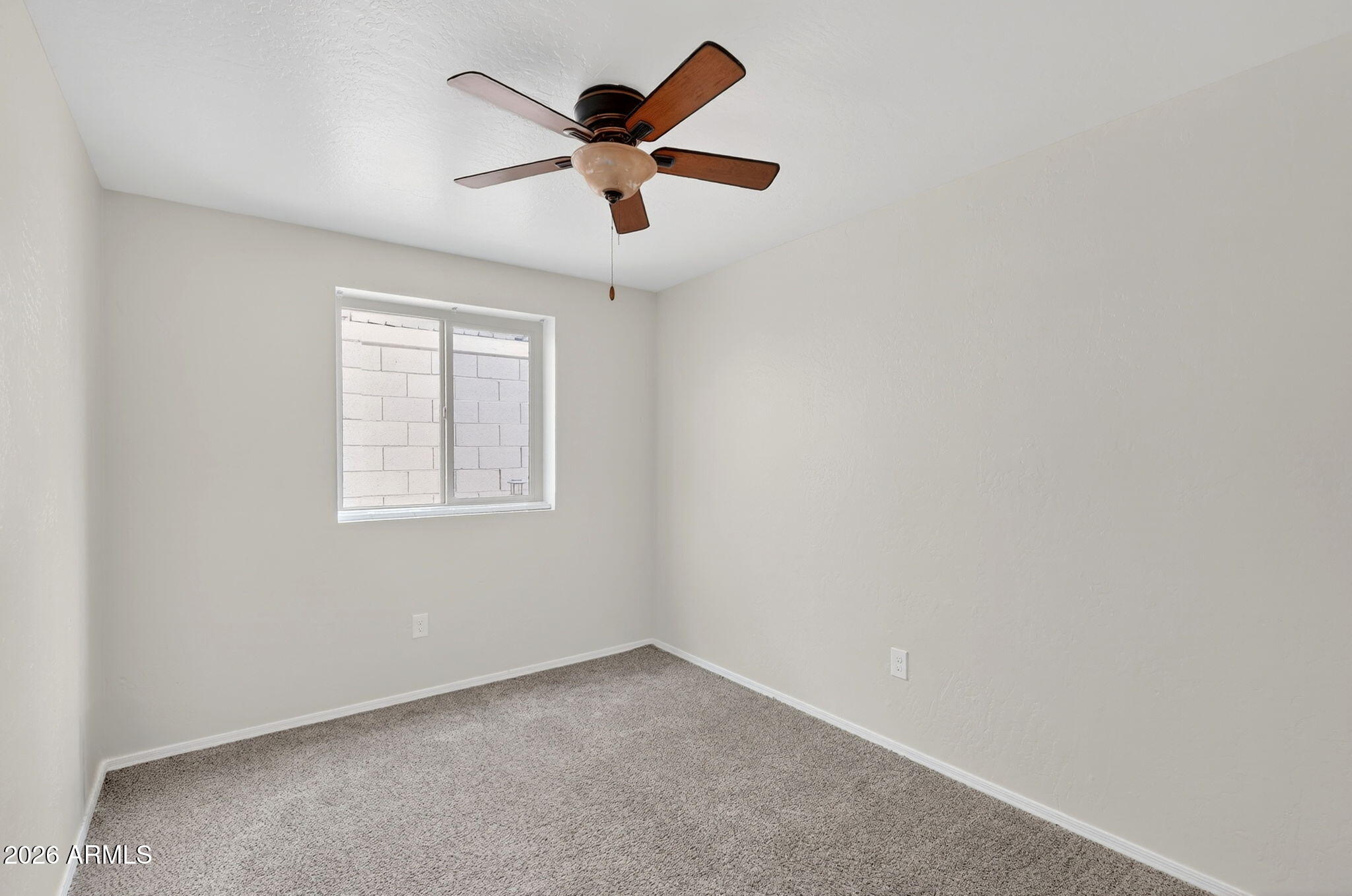 1417 East Mineral Road Gilbert, AZ 85234 - Photo 43 of 59 an empty room with a window and a fan