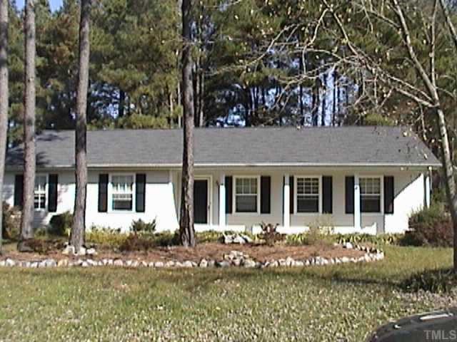front view of a house with a small yard