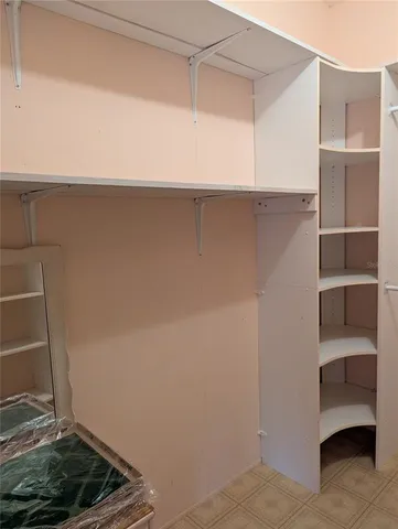 a view of an empty walk in closet