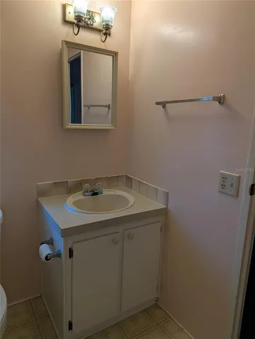 a bathroom with a sink and mirror