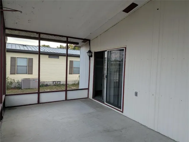 an empty room with sliding glass door