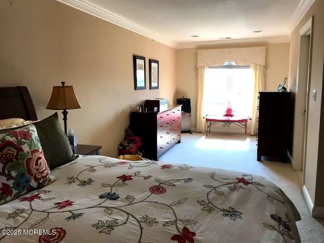 a bedroom with bed and window