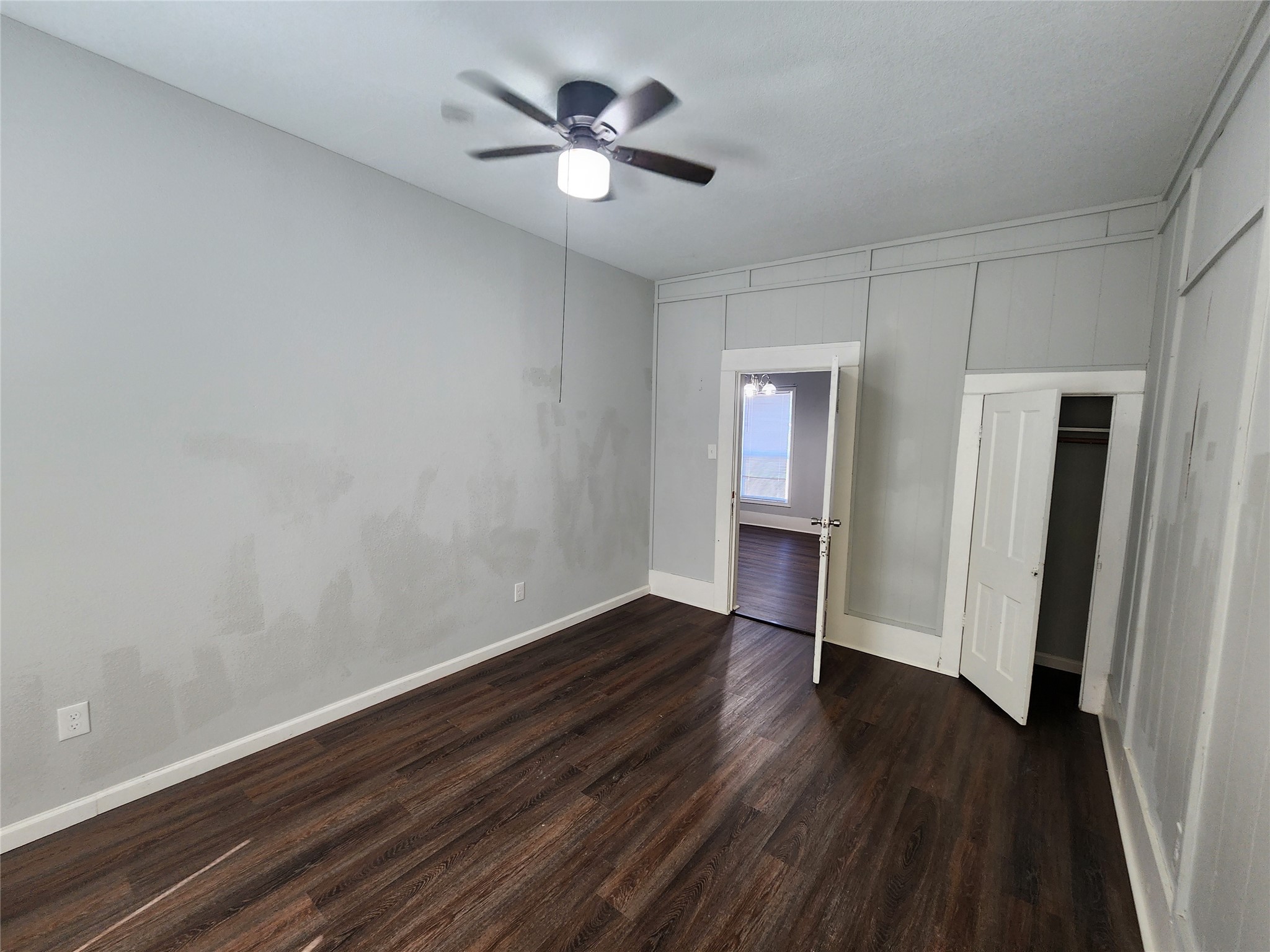 506 9th Street Hempstead, TX 77445 - Photo 12 of 23 wooden floor in an empty room with a window