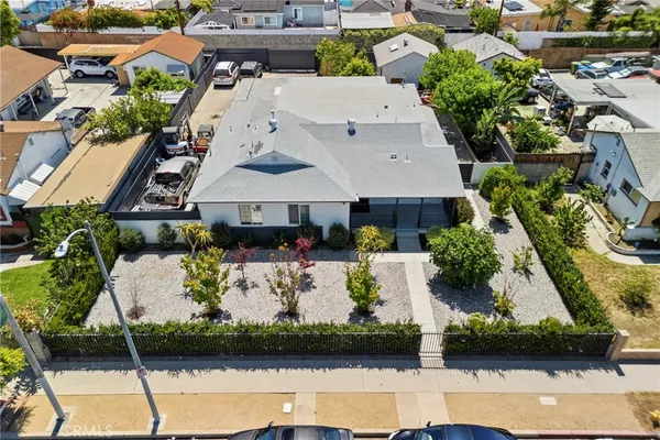 an aerial view of multiple houses with yard