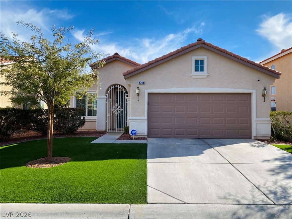8794 Timber Mesa Street Las Vegas, NV 89139 - Photo 1 of 26 This inviting home features a classic stucco exterior, a functional garage, and well-maintained landscaping.