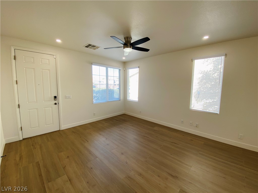 8794 Timber Mesa Street Las Vegas, NV 89139 - Photo 3 of 26 Bright and airy room with durable flooring and excellent light.