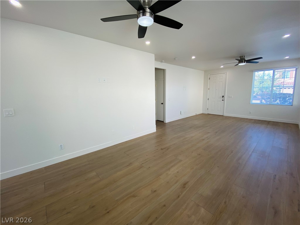 8794 Timber Mesa Street Las Vegas, NV 89139 - Photo 5 of 26 This expansive living area features luminous flooring and abundant natural light, perfect for everyday living.