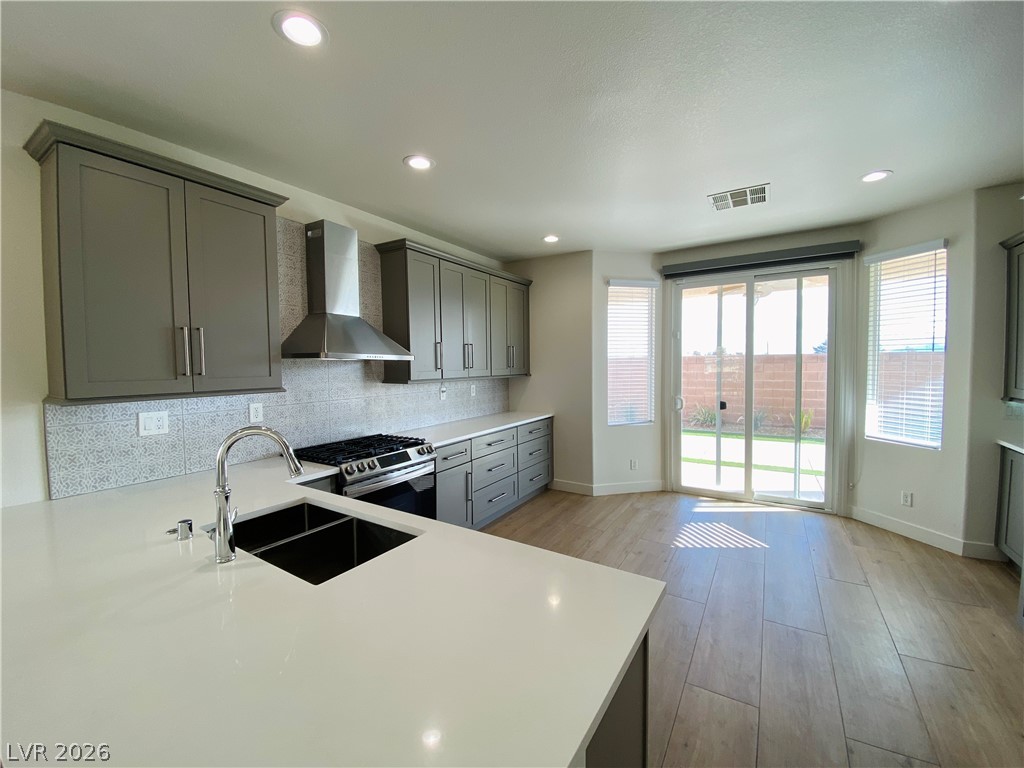 8794 Timber Mesa Street Las Vegas, NV 89139 - Photo 8 of 26 This kitchen offers an ideal space for daily living, blending comfort and style seamlessly.