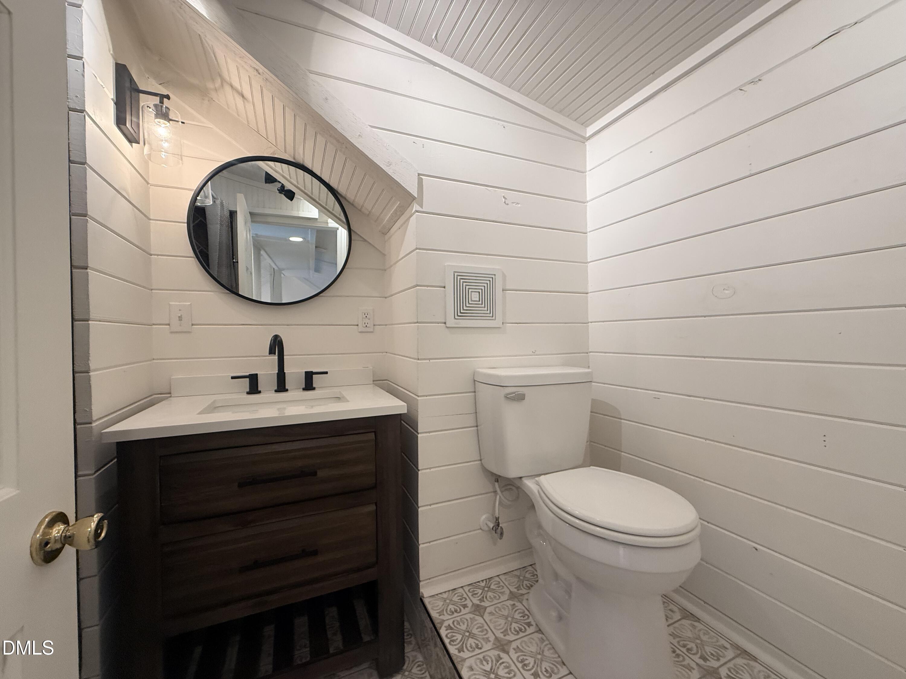 327 Shady Oak Road Roxboro, NC 27574 - Photo 44 of 62 a bathroom with a toilet and a sink