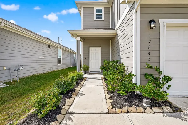 a view of a pathway besides a house
