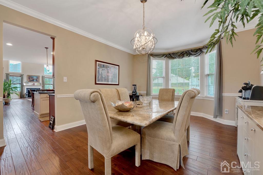 339 Ticetown Road Old Bridge, NJ 08857 - Photo 11 of 44 a view of a dining room with furniture window and wooden floor