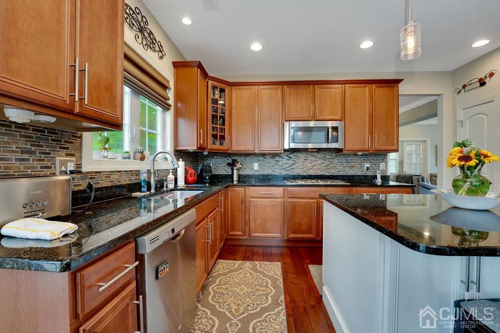339 Ticetown Road Old Bridge, NJ 08857 - Photo 14 of 44 a kitchen with kitchen island granite countertop a sink a counter top space and cabinets