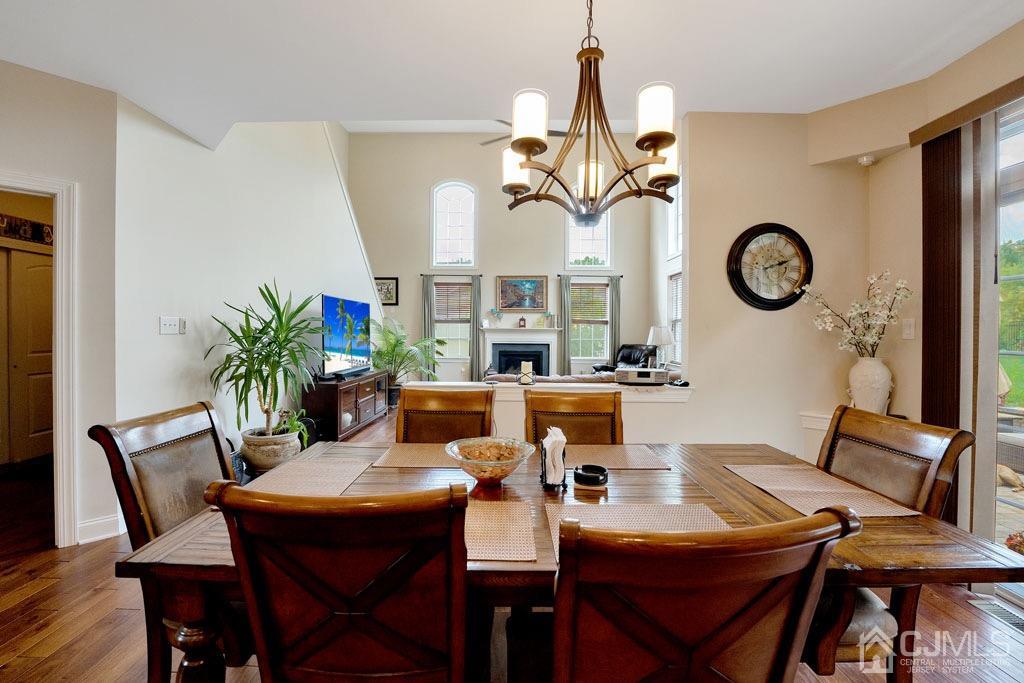 339 Ticetown Road Old Bridge, NJ 08857 - Photo 16 of 44 a view of a dining room with furniture wooden floor and chandelier