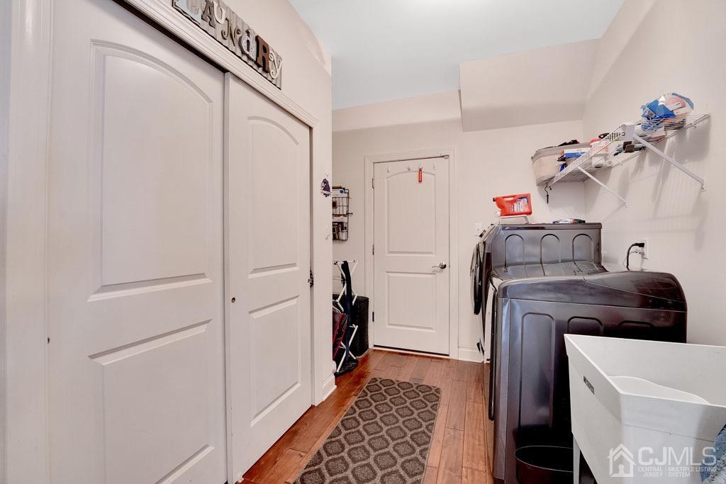 339 Ticetown Road Old Bridge, NJ 08857 - Photo 18 of 44 a view of a utility room with closet dryer and washer