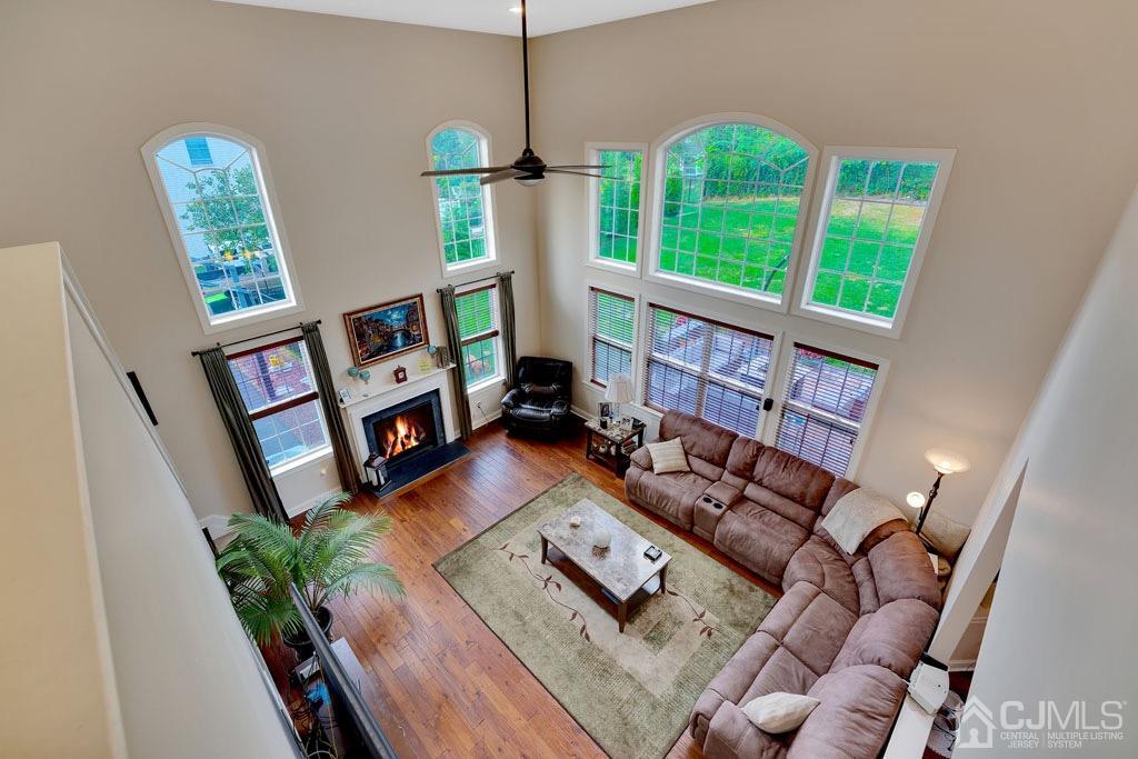 339 Ticetown Road Old Bridge, NJ 08857 - Photo 22 of 44 a living room with furniture and a wooden floor