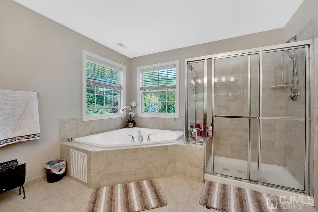 339 Ticetown Road Old Bridge, NJ 08857 - Photo 28 of 44 a bathroom with a tub and a sink