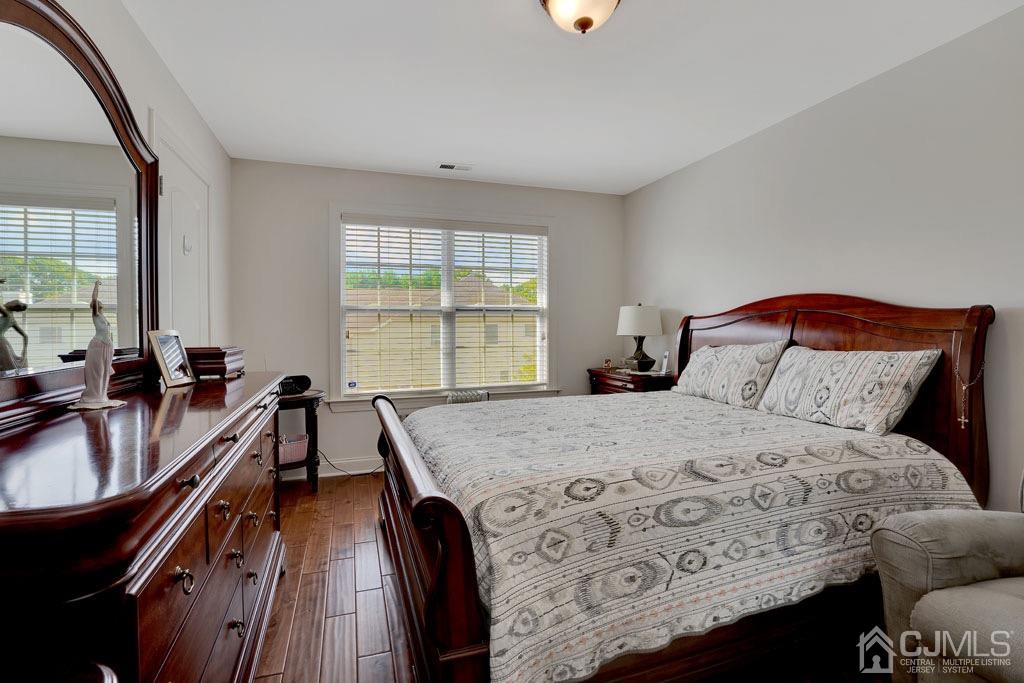 339 Ticetown Road Old Bridge, NJ 08857 - Photo 30 of 44 a bedroom with a bed and a dresser next to a window