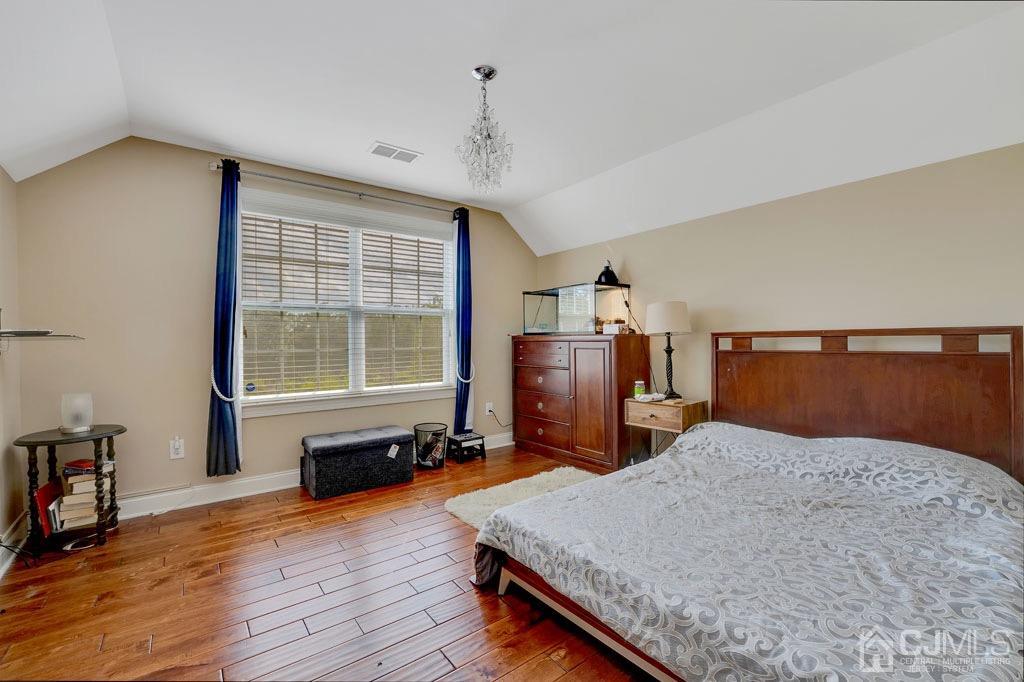 339 Ticetown Road Old Bridge, NJ 08857 - Photo 31 of 44 a bed sitting in a spacious bedroom next to a window