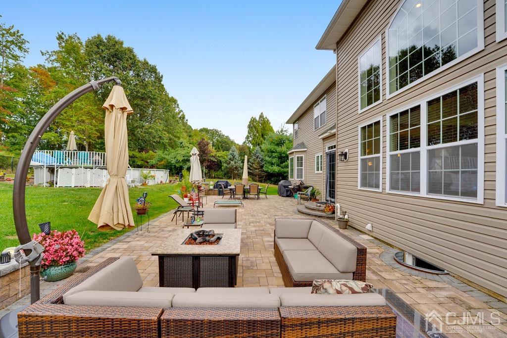 339 Ticetown Road Old Bridge, NJ 08857 - Photo 37 of 44 a view of a patio with couches table and chairs and potted plants