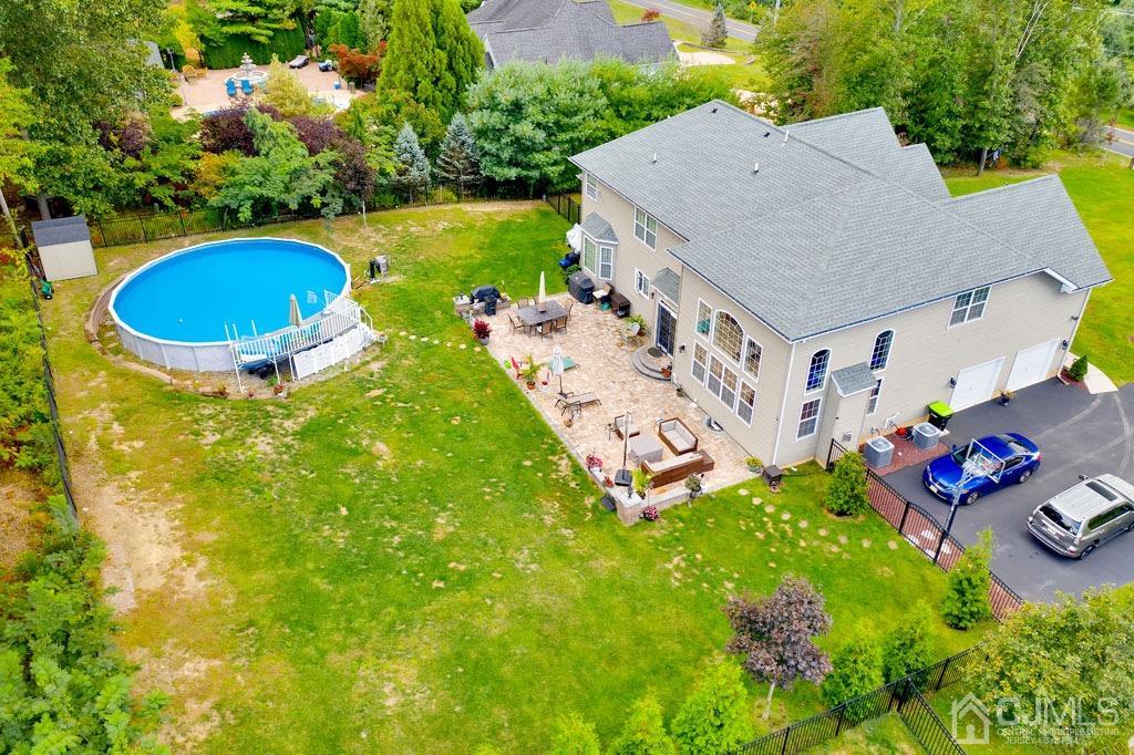339 Ticetown Road Old Bridge, NJ 08857 - Photo 40 of 44 an aerial view of a house with swimming pool and outdoor seating