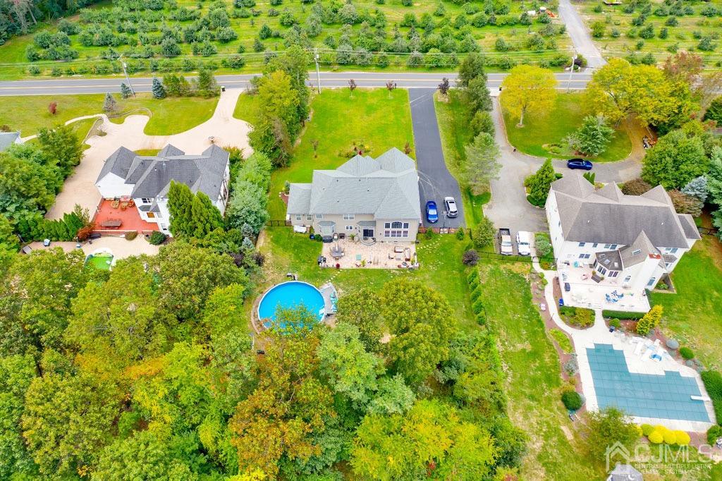 339 Ticetown Road Old Bridge, NJ 08857 - Photo 41 of 44 an aerial view of a house with a swimming pool and garden